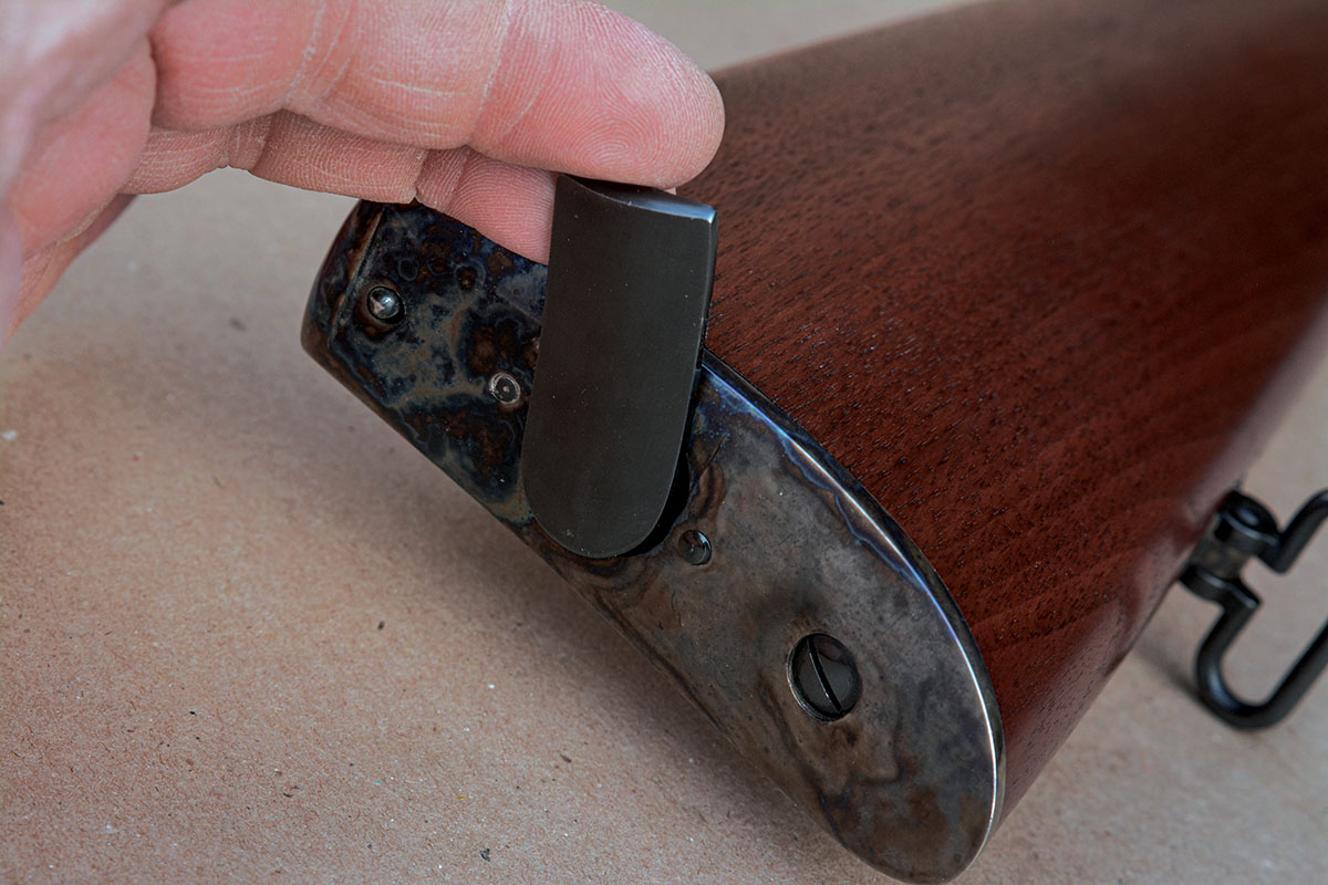 The magazine tube is turned to unlock and withdraw the tube.